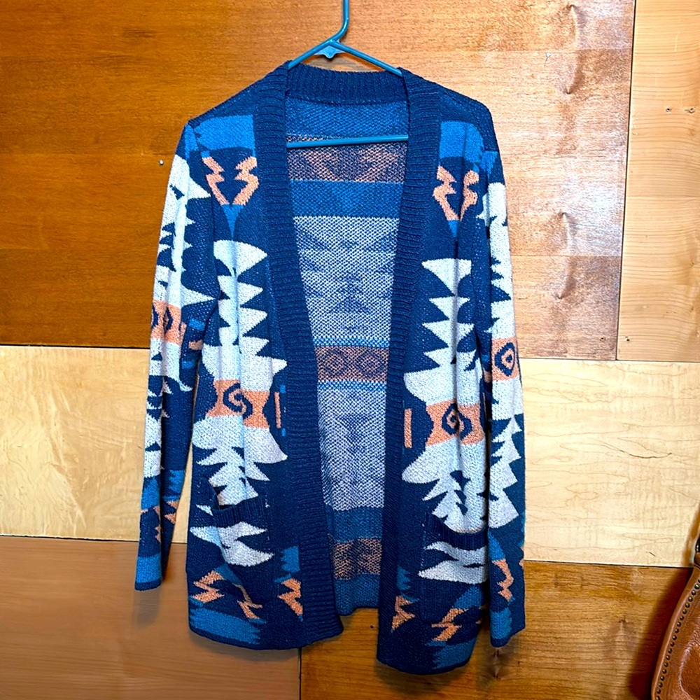 Size Med. Unisex sweater Native/Tribal print blue tan & salmon pockets